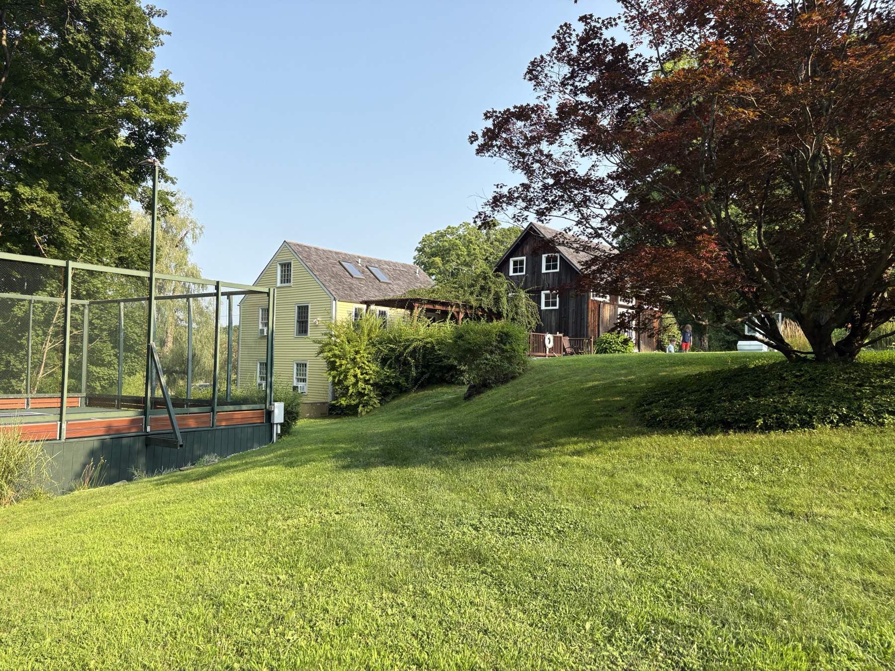 The court, guest house, and barn across the lawn