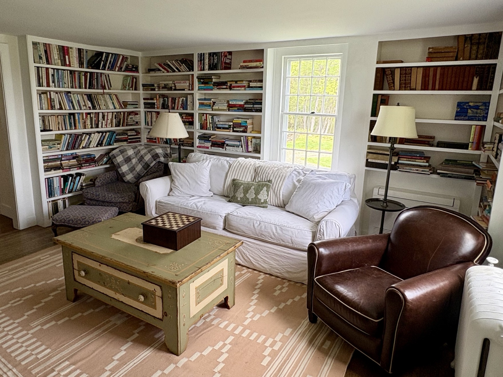 The library, built-in shelves full of good books