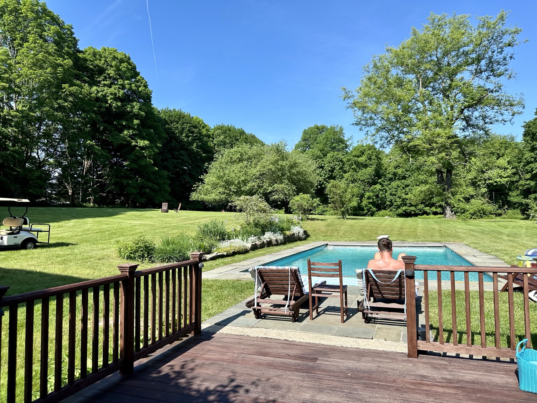 The pool and lawn seen from the deck